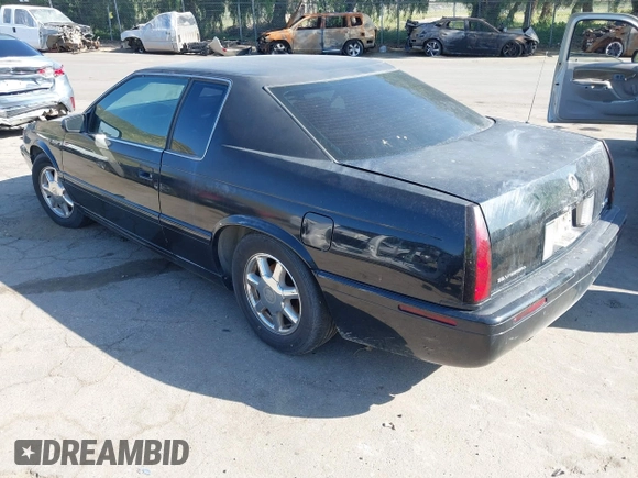 2001 Cadillac Eldorado Touring ETC z VIN 1G6ET12911B103774, wystawiony jako IAAI lot #41998828 z przebiegiem 128 724 mil mil oraz . Historia ofert i sprzedaży dostępna na DreamBid. Obrazek 3.