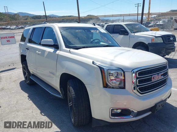 2015 GMC Yukon SLT with VIN 1GKS1BKC3FR102961, listed as a IAAI auction lot 41872717 with 1 mi miles. Bid and sale history available at carsss.com. Image 1.