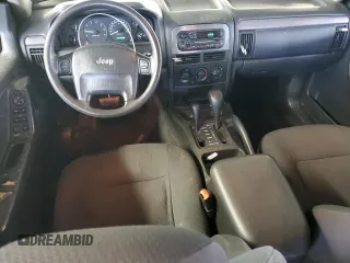 2003 Jeep Grand Cherokee Laredo with VIN 1J4GW48S43C567559, listed as a Copart auction lot 61431595 with 249,998 mi miles and Salvage title. Bid and sale history available at DreamBid. Image 8.