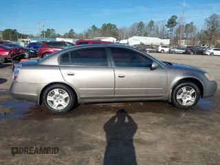 2004 Nissan Altima S with VIN 1N4AL11D24C102557, listed as a IAAI auction lot 41663563 with 151,144 mi miles. Bid and sale history available at carsss.com. Image 13.