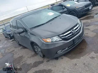 2016 Honda Odyssey Touring Elite with VIN 5FNRL5H97GB010048, listed as a IAAI auction lot 40212711 with 119,009 mi miles. Bid and sale history available at carsss.com. Image 1.