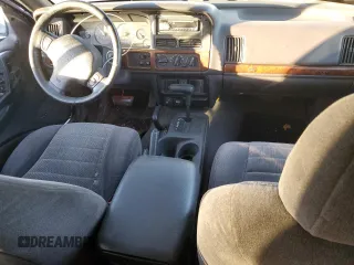 1997 Jeep Grand Cherokee Laredo with VIN 1J4GZ58S7VC685900, listed as a Copart auction lot 82105214 with 151,036 mi miles and Salvage Title. Bid and sale history available at carsss.com. Image 8.