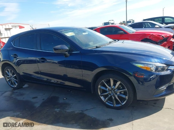 2018 Mazda Mazda3 5-Door Touring with VIN 3MZBN1L37JM272319, listed as a IAAI auction lot 41387550 with 21,376 mi miles. Bid and sale history available at carsss.com. Image 13.