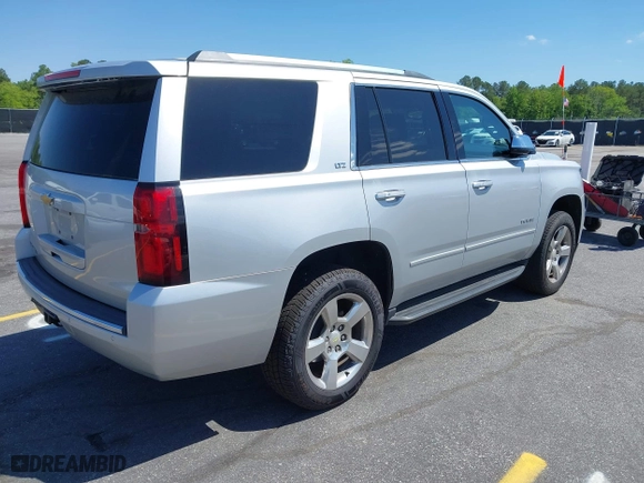 2015 Chevrolet Tahoe LTZ with VIN 1GNSCCKC3FR202934, listed as a IAAI auction lot 41995474 with 258,186 mi miles. Bid and sale history available at carsss.com. Image 4.