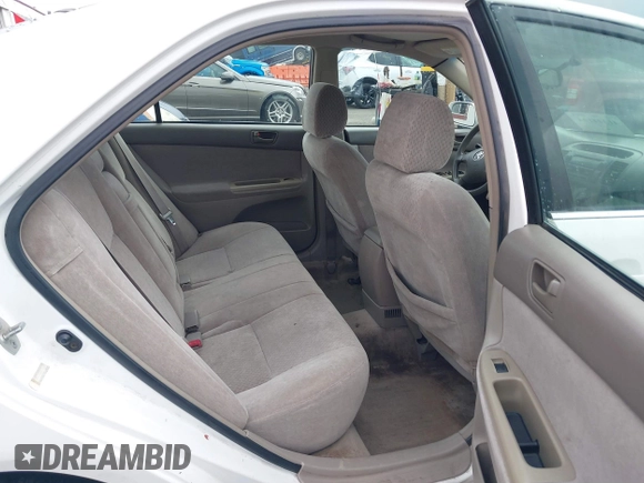 2002 Toyota Camry LE z VIN 4T1BE32K52U081479, wystawiony jako IAAI lot #41344104 z przebiegiem 243 950 mil mil oraz . Historia ofert i sprzedaży dostępna na DreamBid. Obrazek 8.