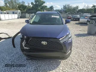 2023 Toyota Corolla Cross LE with VIN 7MUCAAAG0PV063737, listed as a Copart auction lot 86267914 with 13,740 mi miles and Salvage title. Bid and sale history available at DreamBid. Image 14.