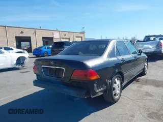 1998 Acura RL Special Edition with VIN JH4KA9686WC009959, listed as a IAAI auction lot 41632413 with 130,788 mi miles. Bid and sale history available at carsss.com. Image 4.