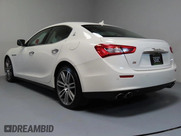 2014 Maserati Ghibli S Q4 z VIN ZAM57RTA7E1094580, wystawiony jako Copart lot #52009445 z przebiegiem 79 463 mil mil oraz Szkoda całkowita • Salvage title. Historia ofert i sprzedaży dostępna na DreamBid. Obrazek 4.