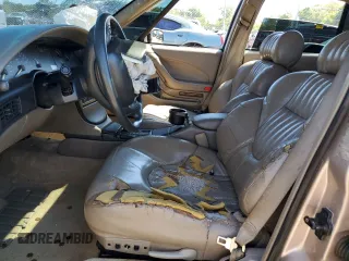 1998 Pontiac Bonneville SE z VIN 1G2HX52K0W4238012, wystawiony jako Copart lot #70997824 z przebiegiem 146 825 mil mil oraz Szkody całkowita. Historia ofert i sprzedaży dostępna na DreamBid. Obrazek 7.