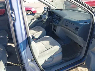 1999 Toyota Sienna LE with VIN 4T3ZF13C2XU126738, listed as a IAAI auction lot 41012127 with 218,080 mi miles. Bid and sale history available at carsss.com. Image 5.