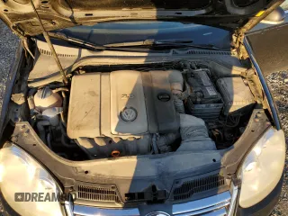 2009 Volkswagen Jetta z VIN 3VWMM31KX9M251901, wystawiony jako Copart lot #84677694 z przebiegiem 299 223 mil mil oraz Szkoda całkowita • Salvage title. Historia ofert i sprzedaży dostępna na DreamBid. Obrazek 11.