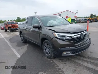 2020 Honda Ridgeline RTL-E with VIN 5FPYK3F78LB001882, listed as a IAAI auction lot 42352980 with 63,278 mi miles and . Bid and sale history available at DreamBid. Image 1.