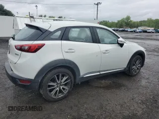 2016 Mazda CX-3 Grand Touring z VIN JM1DKBD77G0105451, wystawiony jako Copart lot #58341495 z przebiegiem 109 525 mil mil oraz Szkody całkowita. Historia ofert i sprzedaży dostępna na DreamBid. Obrazek 3.