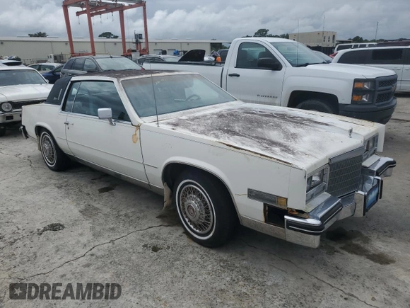 1984 Cadillac Eldorado z VIN 1G6AL5783EE654296, wystawiony jako Copart lot #74945374 z przebiegiem 37 040 mil mil oraz Szkoda całkowita • Salvage title. Historia ofert i sprzedaży dostępna na DreamBid. Obrazek 4.