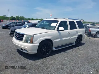 2003 Cadillac Escalade z VIN 1GYEK63N43R222254, wystawiony jako IAAI lot #42228127 z przebiegiem 167 294 mil mil oraz . Historia ofert i sprzedaży dostępna na DreamBid. Obrazek 2.
