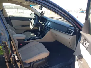 2016 Kia Optima LX with VIN 5XXGT4L32GG108695, listed as a IAAI auction lot 41647970 with 125,319 mi miles. Bid and sale history available at carsss.com. Image 5.