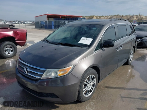 2012 Honda Odyssey EX-L with VIN 5FNRL5H60CB094682, listed as a IAAI auction lot 41570797 with 127,890 mi miles and . Bid and sale history available at carsss.com. Image 19.