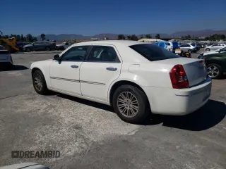 2010 Chrysler 300 Touring with VIN 2C3CA5CV9AH160961, listed as a Copart auction lot 68814424 with 221,248 mi miles and Salvage Title. Bid and sale history available at carsss.com. Image 2.