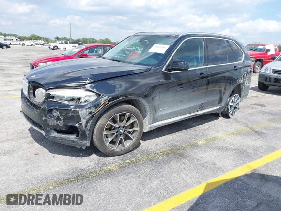 2016 BMW X5 xDrive50i with VIN 5UXKR6C51G0J81658, listed as a IAAI auction lot 41801382 with 34,572 mi miles. Bid and sale history available at carsss.com. Image 2.