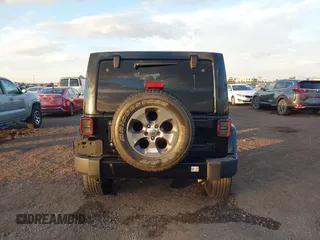 2018 Jeep Wrangler JK Unlimited Sahara with VIN 1C4HJWEG0JL810480, listed as a IAAI auction lot 41260609 with 69,776 mi miles. Bid and sale history available at carsss.com. Image 17.