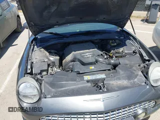 2003 Ford Thunderbird Deluxe z VIN 1FAHP60AX3Y109880, wystawiony jako IAAI lot #42336922 z przebiegiem 213 477 mil mil oraz . Historia ofert i sprzedaży dostępna na DreamBid. Obrazek 10.