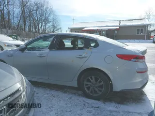 2019 Kia Optima LX z VIN 5XXGT4L3XKG294513, wystawiony jako IAAI lot #41345191 z przebiegiem 101 345 mil mil oraz . Historia ofert i sprzedaży dostępna na DreamBid. Obrazek 15.