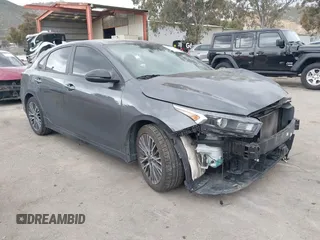 2023 Kia Forte GT-Line z VIN 3KPF54ADXPE598362, wystawiony jako IAAI lot #41857738 z przebiegiem 64 208 mil mil oraz . Historia ofert i sprzedaży dostępna na DreamBid. Obrazek 1.