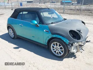 2016 MINI Convertible with VIN WMWWG5C53G3C18842, listed as a IAAI auction lot 41864596 with 91,253 mi miles and . Bid and sale history available at DreamBid. Image 1.
