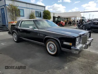 1985 Cadillac Eldorado z VIN 1G6EL578XFE640091, wystawiony jako Copart lot #71849374 z przebiegiem 30 631 mil mil oraz Szkody całkowita. Historia ofert i sprzedaży dostępna na DreamBid. Obrazek 4.