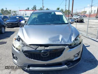 2014 Mazda CX-5 Grand Touring with VIN JM3KE2DY0E0331942, listed as a IAAI auction lot 41750533 with 163,387 mi miles. Bid and sale history available at carsss.com. Image 6.