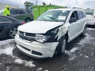 2018 Dodge Journey SE with VIN 3C4PDCAB1JT295988, listed as a IAAI auction lot 41226385 with 106,639 mi miles. Bid and sale history available at carsss.com. Image 2.