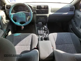 2001 Isuzu Rodeo S with VIN 4S2DM58W114343183, listed as a Copart auction lot 88128465 with 85,926 mi miles and Salvage Title. Bid and sale history available at DreamBid. Image 8.