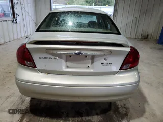 2003 Ford Taurus SE Standard z VIN 1FAFP532X3A195612, wystawiony jako Copart lot #54016645 z przebiegiem 143 168 mil mil oraz Szkoda całkowita • Salvage title. Historia ofert i sprzedaży dostępna na DreamBid. Obrazek 6.