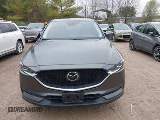 2020 Mazda CX-5 Touring with VIN JM3KFBCM2L0850855, listed as a IAAI auction lot 42147339 with 75,955 mi miles and . Bid and sale history available at carsss.com. Image 12.