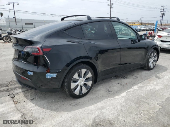 2020 Tesla Model Y Long Range with VIN 5YJYGDEE9LF020148, listed as a Copart auction lot 52031145 with 26,656 mi miles and Salvage Title. Bid and sale history available at carsss.com. Image 3.