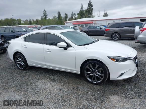 2017 Mazda 6 Grand Touring with VIN JM1GL1X51H1142473, listed as a IAAI auction lot 42234809 with 101,633 mi miles and . Bid and sale history available at DreamBid. Image 14.