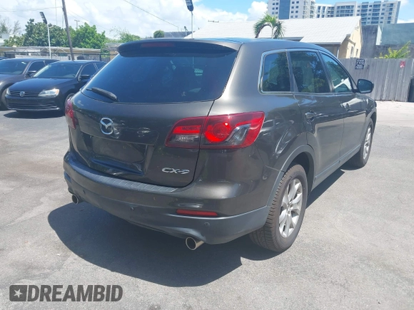 2015 Mazda CX-9 Touring z VIN JM3TB2CV1F0458995, wystawiony jako IAAI lot #42523344 z przebiegiem 130 763 mil mil oraz . Historia ofert i sprzedaży dostępna na DreamBid. Obrazek 4.