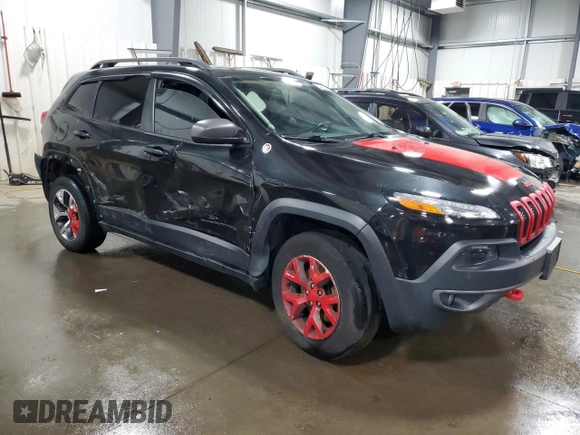 2015 Jeep Cherokee Trailhawk with VIN 1C4PJMBS5FW587545, listed as a Copart auction lot 58820685 with 136,755 mi miles and Salvage title. Bid and sale history available at DreamBid. Image 4.