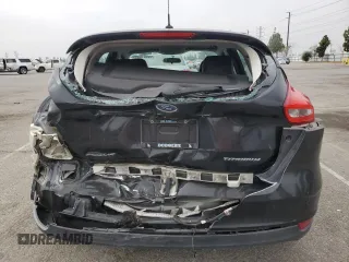 2015 Ford Focus Titanium z VIN 1FADP3N25FL324390, wystawiony jako Copart lot #59801805 z przebiegiem 97 615 mil mil oraz Szkoda całkowita • Salvage title. Historia ofert i sprzedaży dostępna na DreamBid. Obrazek 6.