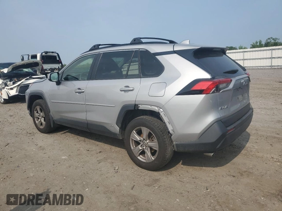 2023 Toyota RAV4 Hybrid XLE with VIN JTMRWRFV7PD166743, listed as a Copart auction lot 59964505 with 87,404 mi miles and Salvage title. Bid and sale history available at DreamBid. Image 2.