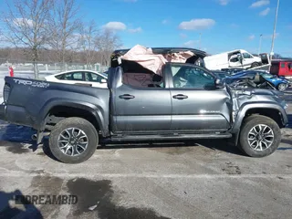 2023 Toyota Tacoma SR with VIN 3TMCZ5AN9PM574534, listed as a IAAI auction lot 41167910 with 27,375 mi miles and . Bid and sale history available at DreamBid. Image 12.