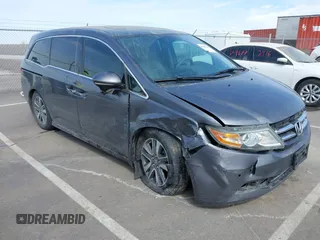 2014 Honda Odyssey Touring with VIN 5FNRL5H91EB093540, listed as a IAAI auction lot 41887412 with 202,076 mi miles and . Bid and sale history available at DreamBid. Image 1.