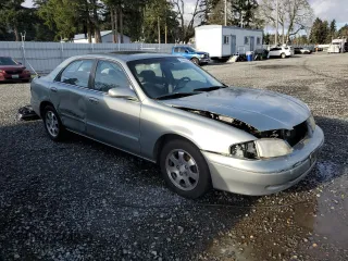 1999 Mazda 626 ES with VIN 1YVGF22C1X5835600, listed as a Copart auction lot 84965004 with 217,352 mi miles and Salvage Title. Bid and sale history available at carsss.com. Image 4.