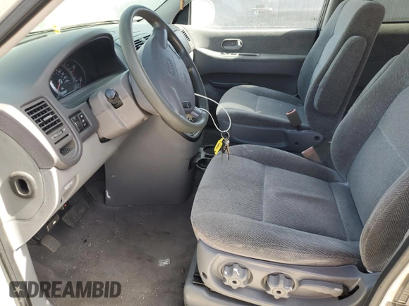 2003 Kia Sedona LX with VIN KNDUP131236453481, listed as a Copart auction lot 75660244 with 125,628 mi miles and Salvage Title. Bid and sale history available at carsss.com. Image 7.