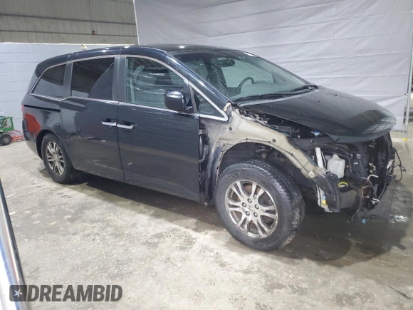 2012 Honda Odyssey EX-L with VIN 5FNRL5H6XCB100522, listed as a Copart auction lot 51431335 with 113,889 mi miles and Salvage Title. Bid and sale history available at DreamBid. Image 4.