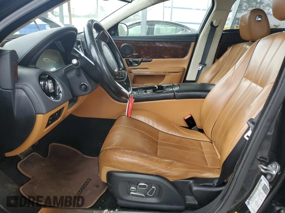 2014 Jaguar XJ Portfolio with VIN SAJWJ2GD5E8V69982, listed as a Copart auction lot 58933515 with 92,847 mi miles and Salvage title. Bid and sale history available at DreamBid. Image 7.