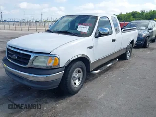 2002 Ford F-150 XL with VIN 1FTRX17242NA69697, listed as a IAAI auction lot 42038258 with 207,008 mi miles. Bid and sale history available at carsss.com. Image 2.