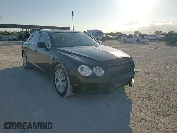 2014 Bentley Flying Spur z VIN SCBEC9ZA2EC090466, wystawiony jako Copart lot #43833305 z przebiegiem 53 837 mil mil oraz Szkody całkowita. Historia ofert i sprzedaży dostępna na DreamBid. Obrazek 14.