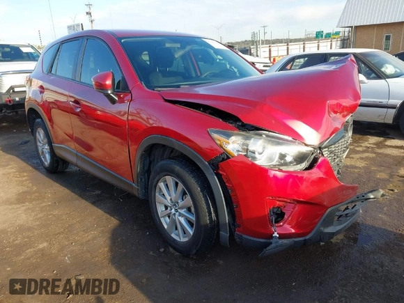 2015 Mazda CX-5 Sport z VIN JM3KE2BE7F0516869, wystawiony jako IAAI lot #41866488 z przebiegiem 131 237 mil mil oraz . Historia ofert i sprzedaży dostępna na DreamBid. Obrazek 1.