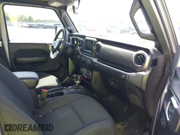 2020 Jeep Gladiator Sport S with VIN 1C6HJTAG7LL128940, listed as a IAAI auction lot 42108154 with 90,596 mi miles and . Bid and sale history available at DreamBid. Image 5.